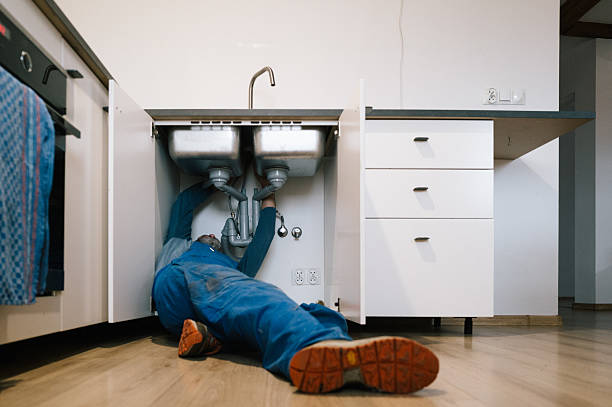 Professional Drain Cleaning technician working in Walpole, MA